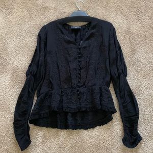 Black blouse with buttons and lace.